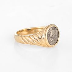 Stylish vintage Bulgari ancient coin ring crafted in 18 karat yellow gold (circa 1970s to 1980s).  The iconic coin ring was created by Bulgari back in the 1960s. The enduring ''Monete'' design is very popular to this day with Bulgari recently releasing new pieces to the collection. The ring is signed "Bactrie 171-135 AV.J.C." and is smaller in scale, suitable for wear on the pinky finger if desired.  The ring is in very good original condition and was recently lightly cleaned and polished.  Part Ancient Style Collectible Yellow Gold Rings, Vintage 14k Gold Coin Ring, Ancient Yellow Gold Intaglio Ring, Ancient Intaglio Rings, Ancient Gold Collectible Rings, Coin Ring, Yellow Gold Jewelry, Ancient Coins, Ring Crafts