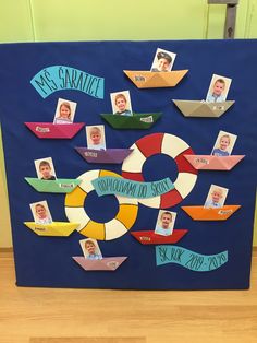 a bulletin board with different types of paper boats and people's names on it