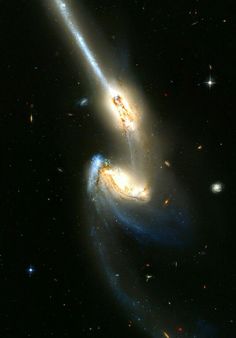 two spiral galaxy like objects in the sky