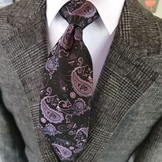 Make a statement at your next formal event with our high quality Black Purple Paisley Silk Tie Pocket Square Cufflink Set. Perfect for weddings or any occasion that calls for formal wear, this set is sure to elevate your look and make you stand out in the crowd. Made from luxurious silk, the tie features a bold paisley pattern in black and purple, while the pocket square and cufflinks perfectly coordinate to complete the look. 100% Silk Handmade Package Includes: Tie, Pocket Square & Cufflinks. Elegant Black Cufflinks For Business, Elegant Adjustable Silver Suit And Tie Accessories, Elegant Black Cufflinks For Wedding, Elegant Black Wedding Cufflinks, Elegant Silver Suit And Tie Accessories For Party, Silver Suit And Tie Accessories For Formal Occasions, Luxury Silver Suit And Tie Accessories For Formal Occasions, Elegant Silver Suit And Tie Accessories For Formal Events, Men Ties