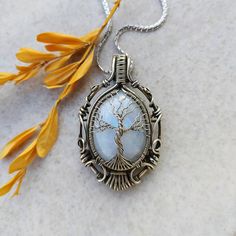 Moonstone tree of life Cooper wire wrapped pendant. Handmade jewelry. With steel stainless chain Moonstone Necklace Silver, Tree Of Life Jewelry, Wire Wrap Jewelry, Wrap Jewelry, Punk Jewelry, Tree Of Life Necklace, Tree Of Life Pendant, Jewelry Tree, Wire Wrapped Necklace