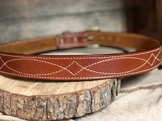 Our beautiful hand-crafted Western stitched English Bridle Vegetable-tanned leather belts that we line with a beautiful tan suede giving this belt durability and strength, yet still making it flexible for comfort. The thickness (13oz.) of this belt is perfect for carrying a gun or other accessories that attach to your belt, or if you prefer to wear for the high end appearance this gives any attire. **COLOR PREFERENCE -Golden Brown -Buck Brown -Rich Brown -Havana **BUCKLE PREFERENCE -Antique Nick Western Belts With Belt Loops For Everyday Use, Classic Adjustable Embroidered Belt, Leather Western Belts For Everyday, Concealed Carry Belt, Belt Western, Tan Leather Belt, English Bridle, Tan Suede, Natural Brown