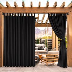 an open patio door with black curtains on it