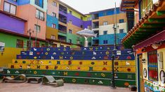 colorfully painted steps in front of multi - colored buildings