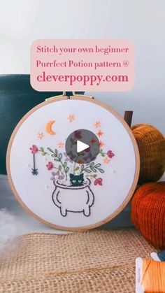 a video demonstrating how to make an embroidery pattern for a cat with flowers in it