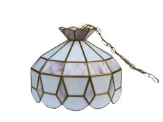 a stained glass lamp hanging from a chain