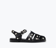 A tougher fisherman sandal. Handcrafted with our signature black calf, the SERA is classic with the caged upper and padded footbed but reimagined this season with cool understated studs. This style has a roomier fit. If you’re in between sizes or have a narrow foot, take a 1/2 size down. 100% Italian leather in black calf Padded leather footbed Studded welt leather sole with rubber layer for enhanced durability Adjustable strap with custom buckle Custom stud detail across upper leather Luxury Open Toe Fisherman Sandals, Luxury Fisherman Sandals For Spring, Affordable Open Toe Fisherman Sandals For Vacation, Luxury Women's Fisherman Sandals For Spring, Luxury Summer Fisherman Sandals With Woven Sole, Luxury Closed Toe Classic Fisherman Sandals, Luxury Open Toe Fisherman Sandals For Formal Occasions, Luxury Classic Closed Toe Fisherman Sandals, Luxury Women's Round Toe Fisherman Sandals