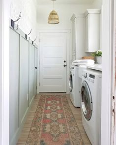 a washer and dryer in a small room