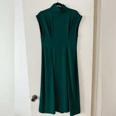 Never Worn, Beautiful Zara Woman Midi Dress, Perfect For Any Elevated Occasion With Heels Or Dressier Work Look, Emerald Green, Two Front Pleats With Flow, Sleeveless With Wider Shoulder Width And Mock Neck. Really Pretty! Size S, Flowy Bottom - I’m 5’8” And It Would Hit Me Mid-Calf Spring Classic High Neck Dress, Classic High Neck Spring Dresses, Fitted Green Midi Dress With High Neck, Zara Classic Workwear Dresses, Green Stretch Midi Dress For Work, Zara Green A-line Maxi Dress, Classic Fitted Zara Dress, Zara Sleeveless Maxi Dress For Work, Green Sleeveless Maxi Dress For Work