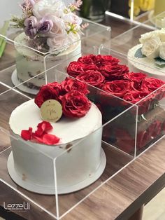 three different types of cakes with red roses on top and white cake in the middle