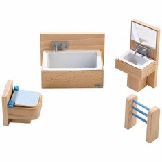 three wooden toys including a sink, toilet and bathtub