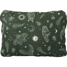 a green pillow with white drawings on it and stars, moths, and other things