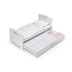 two white twin beds with pink bows on them