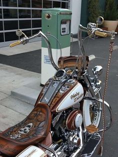 a motorcycle parked next to a parking meter