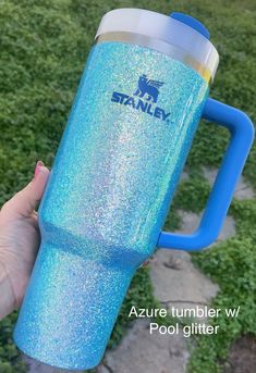 someone is holding up a blue yeti cup in their hand with the words, azure tumbler w / pool glitter on it