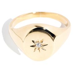 Forged in 9 carat gold, this smart vintage signet ring features a star set diamond shimmering at the centre of an oval domed top. We have named her The Arden Ring. She puts a dapper finishing touch to your chosen attire and keeps a low profile, making her look the part no matter the time or place. The Arden Ring Gem Details The round brilliant cut diamond weighs approximately 0.03 carats with G colour and P1 clarity grades. Ring Size V (Australia and UK sizing) or 10 3/4 (US and Canada) The Arde 14k Gold Star Shaped Signet Ring With Polished Finish, Classic 14k Gold Star Shaped Signet Ring, Elegant 14k Gold Star-shaped Signet Ring, Classic 14k Gold Star-shaped Diamond Ring, Classic Yellow Gold Star-shaped Diamond Ring, Star-shaped Signet Ring In 14k Gold For Anniversary, Gold Oval Signet Ring With Diamond Accents, Anniversary Star-shaped Signet Ring In 14k Gold, Oval Gold Signet Ring With Diamond Accents