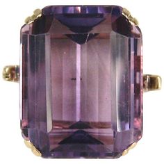 Stunning large Emerald Cut Amethyst Cocktail ring. Wonderful 14K Gold Setting on this ring. The Ring is a size 5-1/4 and can be sized by us or your jeweler, This ring sits high off the finger .37 in. Measuring .64 in top to bottom x .54 in wide. Be sure to check our store front for more fabulous pieces from this collection. We have been selling this collection on 1st dibs since 2013. You can Follow us via storefront as well. Thank you, Any questions please call, email or hit contact. Rings Purple, Wide Gold Ring, Amethyst Cocktail Ring, Sapphire Cocktail Ring, Purple Rings, Purple Amethyst Ring, Emerald Cut Rings, Golden Jewelry, Gold Statement Ring