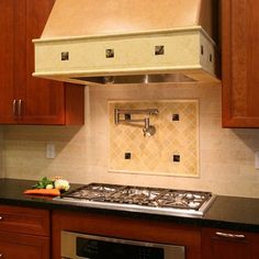 a stove top oven sitting inside of a kitchen next to wooden cabinets and counter tops