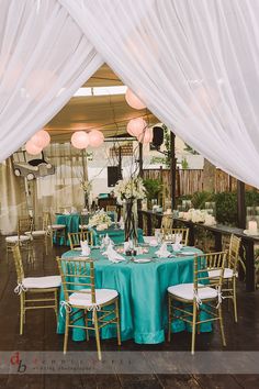 the tables are set with blue and white linens