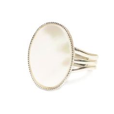 This classic gemstone ring features a natural, semi-precious Mother of Pearl cabochon (18 x 13 mm) on an elegant band.The creamy white Mother of Pearl cabochon shimmers in the light. Mother of pearl has a very distinct multi-coloured effect and a faint moon-like glow.The Sterling silver plated ring is adjustable so one size fits all. Nickel and lead free.This ring is available in other gemstone options from my Etsy store.***********************************************************Gemstone informa Silver Oval Rings With Mother Of Pearl, Oval Mother Of Pearl Ring Gift, White Oval Cabochon Pearl Ring, Oval Mother Of Pearl Ring With Polished Finish, Oval Mother Of Pearl Jewelry With Polished Finish, Steampunk Rings, Oyster Pearl, Gothic Rings, Gift Of Time