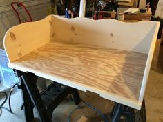 an unfinished shelf being built with plywood