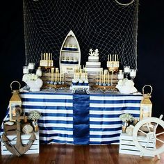 a table topped with lots of cakes and desserts