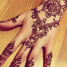 a henna tattoo on someone's hand