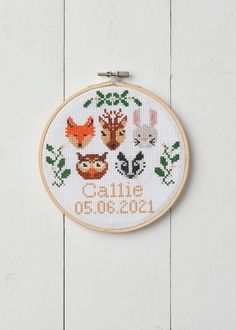 a cross stitch pattern with animals on it and the words hello 2013 written in orange