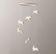 a white rabbit mobile hanging from the ceiling