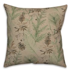 a decorative pillow with pine cones and leaves printed on the front, along with an evergreen leaf design