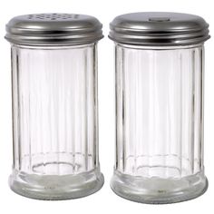 two glass salt and pepper shakers with metal lids on white background, side by side