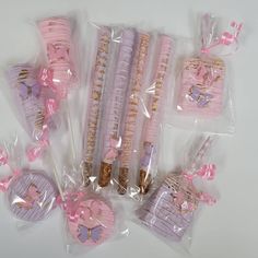 some pink and purple candy sticks wrapped in plastic