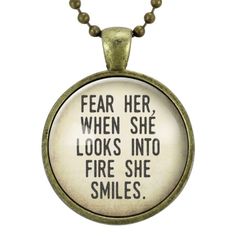 a necklace with the words, fear her when she looks into fire and smiles on it