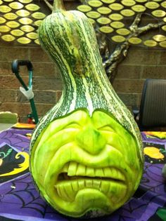 a pumpkin shaped like a face on top of a table