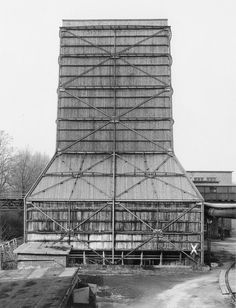 an old building with scaffolding on the front and side of it's roof