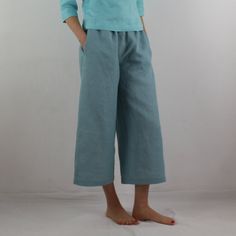 "Women linen pants with 2 pockets in grayish blue color, perfect for casual wear and suitable for any occasion in any season Details: - 100% natural linen produced in Europe ; - medium weight (180 gram per square meter); - color: grayish blue, can be any from our colors catalogue (color samples at the photo); Made to order, approximately a few days, If you have any questions please message me and I will be glad to answer. Size guide : Size XS Bust: fits bust around 33\"-34\"/ 84-88 cm Waist: fit Blue Linen Wide-leg Pants, Blue Linen Ankle-length Wide Leg Pants, Blue Linen Pants With Loose Fit, Casual Turquoise Wide Leg Bottoms, Turquoise Bottoms With Pockets For Summer, Turquoise Summer Bottoms With Pockets, Linen Apron Pinafore, Women Linen Pants, Linen Casual Dress