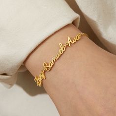 "Elegant Multiple Names Bracelet: Unique Gold Personalized Bracelet for Women - Perfect Name Plate Bracelet Gift for Wife, Sister, or Girlfriend Our Elegant Multiple Names Bracelet is a meaningful piece of jewelry that effortlessly combines style and sentiment. Its delicate and timeless design makes it a versatile accessory, symbolizing love and connection. Each bracelet is crafted to tell a story, representing the important women in your life. 📜 Meaningful Names: Every name on the bracelet carries a story, making it a treasure trove of memories and love. ⌛ Timeless Accessory: Its elegant design makes it suitable for daily wear, as well as special occasions. 🌟 Special Personal Touch: Customizing the bracelet with names makes it uniquely yours, creating a one-of-a-kind piece. 🎁 Perfect G Grandmas Mothers Day Gifts, Personalized Wedding Rings, Moms Bracelet, Fingerprint Jewelry, Monogram Jewelry, Feather Necklaces, Name Bracelet, Timeless Accessories, Engraved Jewelry