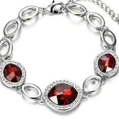 Rhinestone Border Fancy Leaf Red Jewels Bracelet - Made With Swarovski Silver Plated Bracelet Featuring: One 14x11mm Red Fancy Leaf Crystals By Swarovski Two 10x8mm Red Fancy Leaf Crystals By Swarovski Silver Plated 7" Bracelet With 1.5" Extender Lobster Claw Clasp Elegant Crystal Bracelet With Stones, Elegant Red Bracelets For Party, Silver Crystal Bracelet With Stones For Party, Red Crystal Bracelet Gift, Red Jeweled Bracelet For Party, Red Crystal Bracelet For Gift, Red Crystal Bracelet For Party, Red Crystal Bracelet For Wedding, Elegant Silver Jeweled Crystal Bracelet