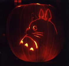 a pumpkin carved to look like a cat