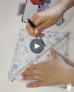 someone is using a ruler to measure something