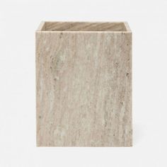 a white marble block on a grey background