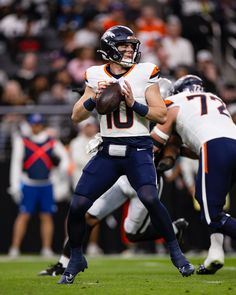 a football player is getting ready to throw the ball