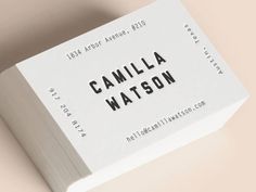 a white business card with the words camila watson printed on it