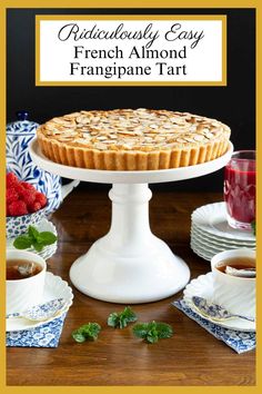 an image of a pie on a table with plates and cups in the foreground text reads ridiculously easy french almond franpane tart