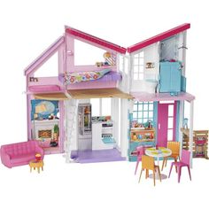 a doll house with furniture and accessories in it