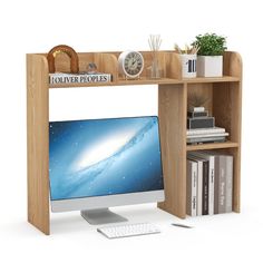 a computer monitor sitting on top of a wooden desk