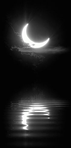 the moon is reflected in the water with its reflection on it's surface,