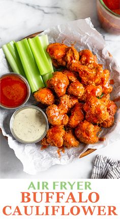 buffalo cauliflower wings with ranch dressing and celery sticks on the side