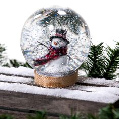 a snow globe sitting on top of a wooden table