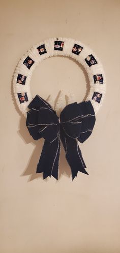 a black and white wreath with pictures on it